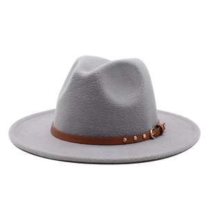 Detail of light gray fedora hat with brown leather band and gold rivet accents
