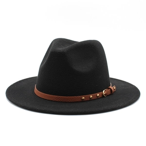 Close-up of black wool fedora with brown faux leather band and gold metal buckle detail