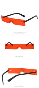 Detail view of red rectangle sunglasses showing narrow frames and sleek black temples