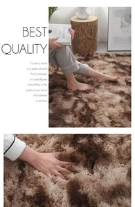 Close-up of soft dark brown tie-dye plush rug texture and thickness in a cozy setting