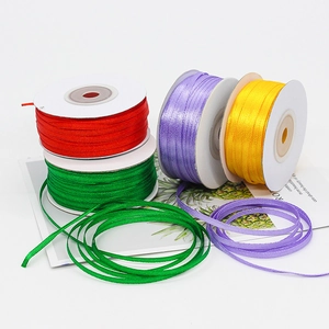 3mm colorful satin ribbons on white spools for gift wrapping and DIY crafts