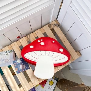 Detailed top view of red and white mushroom-shaped PU leather crossbody bag with chain