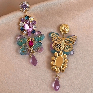 Elegant gold butterfly earrings with colorful crystals and teardrop pendants
