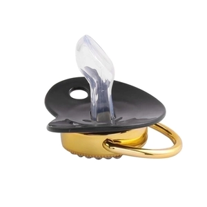 Luxury black baby pacifier with gold handle and clear silicone nipple on white background
