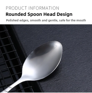Macro view of a polished stainless steel oval spoon head with smooth rounded edges