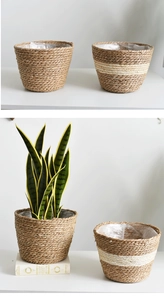 Detail of hand-woven straw planter basket with waterproof lining and natural wood finish