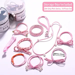 10-piece pink hair accessories set with bows and pearls in clear storage cylinders