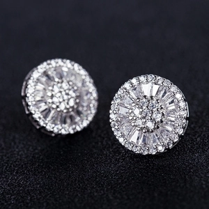 Sparkling silver flower stud earrings with brilliant zircon stones on black background