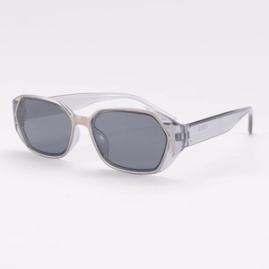Vintage square sunglasses with transparent grey frames and rose gold metal trim detail