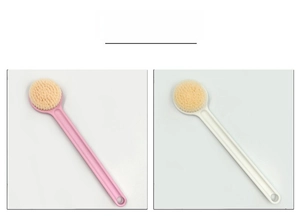 Detail of pink and white long-handled bath brushes with dense bristles and hanging holes