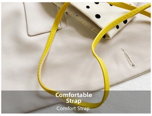Detail of a bright yellow adjustable comfort strap with precise stitching for kids bags