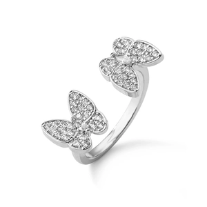 Macro shot of 18K gold plated ring with double butterfly motifs and sparkling zircons