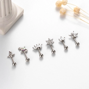 Set of six polished steel cartilage studs with zircon flower and crown detail