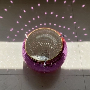 Detailed top view of a pink disco ball hanging planter with mirror reflections