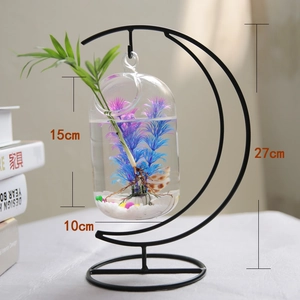 Detail of moon-shaped black iron stand with hanging glass vase showing 27cm height