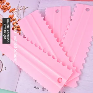 4-piece set of pink dual-sided cake scrapers with various serrated edges for baking decor