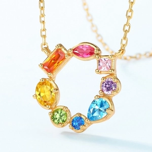Rainbow cubic zirconia pendant necklace with assorted colorful gemstones on a gold chain