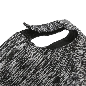 Macro detail of breathable grey marl fabric and adjustable velcro closure on baseball cap
