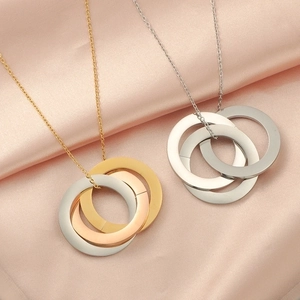 Polished stainless steel interlocking triple ring necklace in tricolor and silver finish