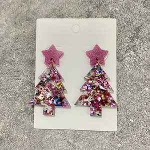 Detailed view of acrylic Christmas tree earrings with glitter stars and colorful sequins