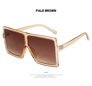 Detail of pale brown oversized square sunglasses with gradient lenses and smooth temples