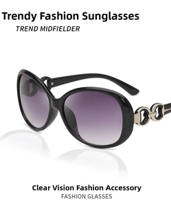 Detail of elegant black oversized sunglasses with heart-shaped metal hollow hinge design