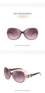 Detail of red transparent dual-tone oversized sunglasses with gradient purple lenses