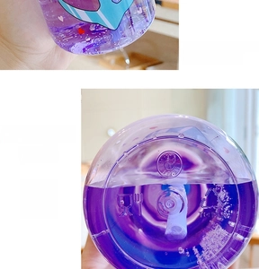 Detail of purple Tritan plastic water bottle showing BPA free material and base markings