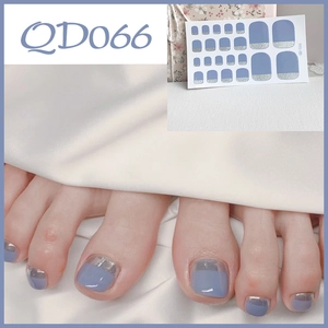 Detailed view of blue and silver glitter French toe nail stickers, model QD066 set