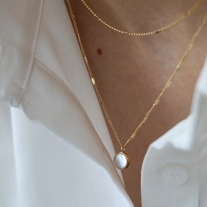 French luxury style double-layer gold necklace with round mother of pearl pendant