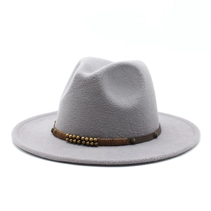 Detailed view of grey wool felt fedora featuring a brown leather band with metal beads