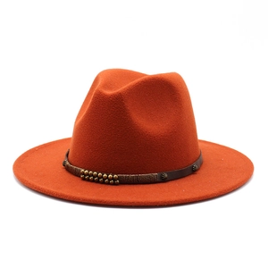 Detail of orange wool fedora featuring a brown leather band with metallic bead accents