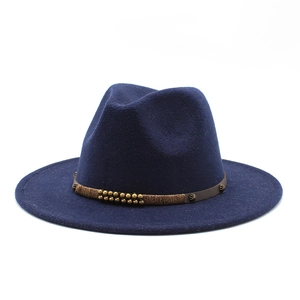 Detail of navy wool fedora hat featuring a vintage gold beaded band and straight wide brim