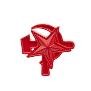 Detail of red enamel badge featuring a star and hammer and sickle design on white background