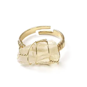Handmade gold wire wrapped open ring featuring raw natural yellow crystal stone