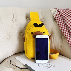 Canvas duck chest bag showing compact size next to a mobile phone for scale reference