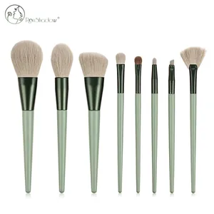 Detail view of 8 professional makeup brushes with green matte handles and soft bristles