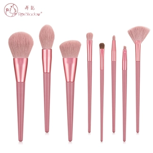 Detail of 8 pink professional makeup brushes showing soft bristles and matte handles