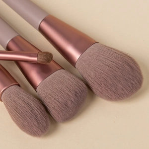 Detail of 8pcs makeup brushes with grey-brown bristles and rose gold ferrules
