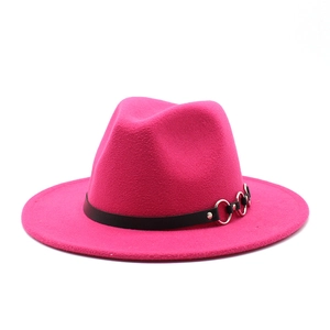 Detail of rose pink fedora hat featuring black leather band and silver metal rings