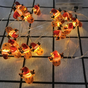 Detailed view of warm LED Christmas reindeer string lights with transparent battery box