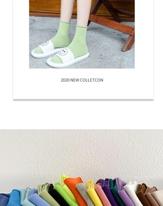 Detail of colorful ribbed cotton socks with rolled edge cuffs in multiple vibrant candy colors
