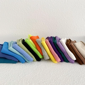 Colorful knitted cotton slouch socks for women in assorted candy colors with rolled edges