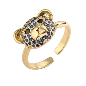 Adjustable bear ring in gold plating featuring micro-paved blue and black stones