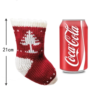 Detailed size comparison of a 21cm red knitted Christmas stocking with white snowflake patterns