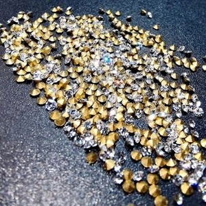 Close-up of sparkling gold and silver rhinestones for vanity mirror decoration
