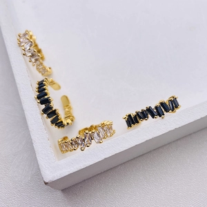 Adjustable gold rings set with rectangular micro-pave crystals and cubic zirconia