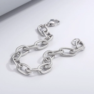 Macro shot of silver titanium steel cable chain bracelet with detailed rope texture links