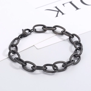 Close-up of matte black cable link chain bracelet with detailed twist texture and lobster clasp