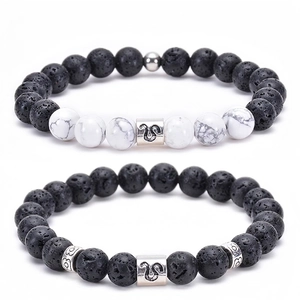 Detail of Leo zodiac bracelets featuring natural lava stone and white turquoise beads